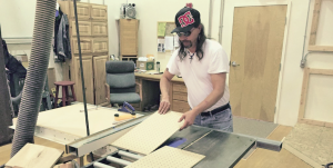 Student makes a cut on the table saw