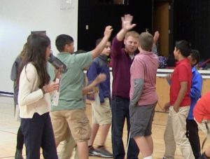 Ryan High-Fives with the students after shooting some hoops