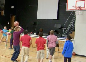 Ryan shoots some hoops with a group of students from Mile High Academy