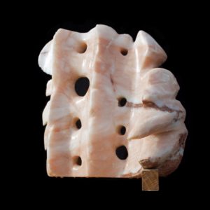 An alabaster sculpture with flowing and spiky elements