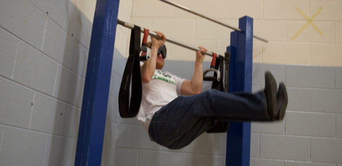 Ryan at the Pull Up Station doing leg lift pull ups