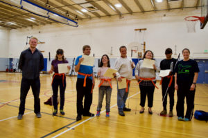 Martial Arts group - Orange Belts and Certificates - Travis, Ceci, Mike, Serena, David, Showe, Chaz and Rachael