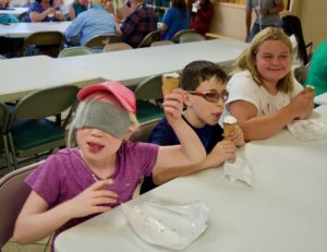 Chloe, Ty and Jasmine with smiles and ice cream cones