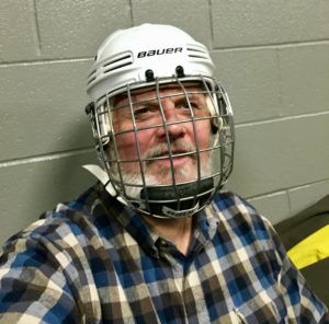 Dan in his hockey helmet and mask