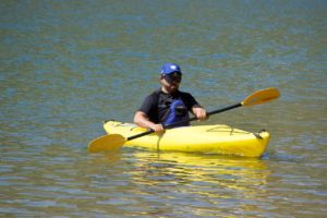 Cesar in a yellow Kayak at Bear Creek Lake Park Right profile straight on