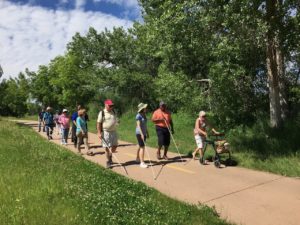 Seniors hike along a Greenway Trail