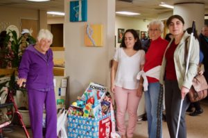 Seniors fill the Toy Donation Box - Judi, Carrina, Dee, Anahit