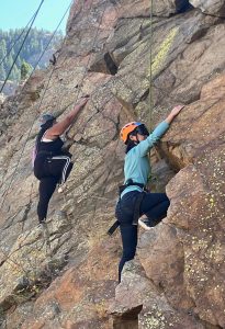 Casey and Talia synchronized climbing