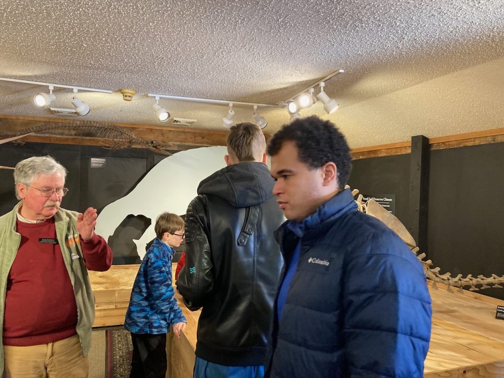 Doug, our Museum tour guide talks to the visitors in the Cretaceous room