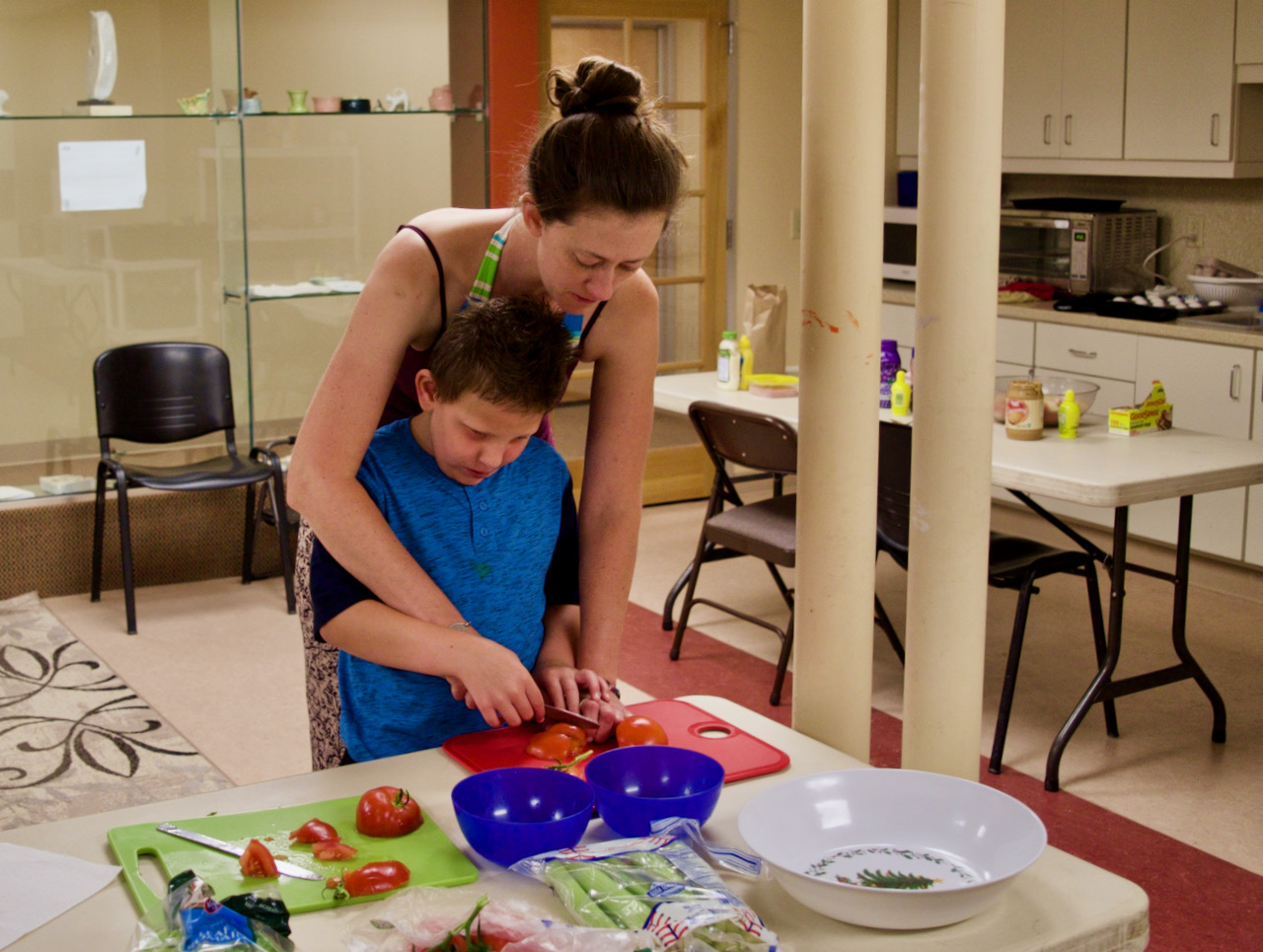 Seamus Learns how to Slice Tomatoes for Lunch with his Teacher